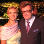 Actor/comedian Greg Proops acting as auctioneer, with Sophie Gayot