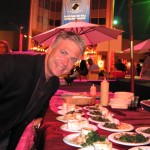 Master of Ceremonies Frank Mottek from KNX Business Hour over M Café table