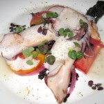 Grilled squid with heirloom tomato salad, black rice, yuzu red onions, umami broth and seaweed tartare