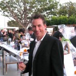 Brian Pope, March of Dimes board of director member, in front of the silent auction table