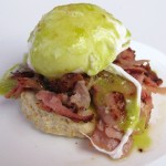 Green eggs & ham benedict with house baked ham, biscuit and chive hollandaise