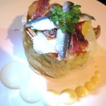 Caesar with poached organic egg, dried prosciutto and anchovies