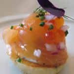 House smoked and sturgeon with lemon herb blinis, dill crème fraîche, chives, sweet onions and salmon pearls