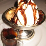 C.C. Brown's Hot Fudge Sundae: prepared tableside with Häagen-Dazs vanilla ice cream, toasted almonds, whipped cream and C.C. Brown's Hot Fudge