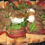 Italian Umbria shaved black summer truffle tart with Coppa ham, buratta and Arbequina olive oil