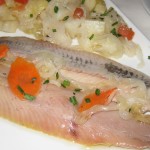 Herrings marinated with warm boiled potatoes and onions