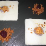 Very thin slices of Vermont cheddar with mustard linzer and blackberry compote