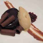 Dark chocolate torte with spiced cherries and roasted white chocolate