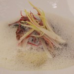 Diver scallops, carmelized endives and parsnips agnolotti, and sake-marinière broth