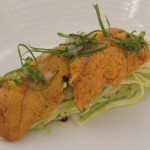 Sea urchin on apple cabbage as it comes to the table