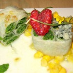 Organized arugula salad with raspberries, corn and Cabrales blue cheese
