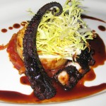 Braised octopus with piperade, Yukon gold potatoes and veal reduction