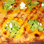 Butternut squash tart with caramelized onions, goat cheese, arugula and balsamic reduction