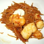 Paella-style pasta with monkfish and shrimp, cooked in seafood broth