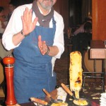 Partner/owner Norbert Wabnig of The Cheese Store of Beverly Hills preparing raclette