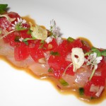 Hiramasa crudo with compressed watermelon, fried garlic, ponzu and cilantro flowers