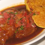 Braised pork cheeks with lime and onions