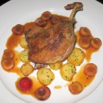 Confit de canard à l'orange: duck leg with cherries and Sarladaise potatoes