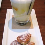 Orange creamsicle float with orange sorbet, cream soda and cardamom madeleine