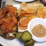 Loch Duart salmon pastrami with grilled country bread, lemon slaw, dill pickles, grain mustard and potato chips