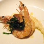 Grilled "angry" prawns: crispy garlic, basil, orange, Calabrian chili dressing and heirloom Toscanelli white beans