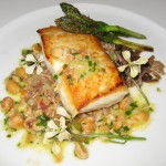 Wild Alaskan halibut, sautéed, with yellow foot chanterelles, farro grain, and Meyer lemon vinaigrette