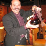 General manager Joel Hoachuck pouring 2009 Giana Zinfandel from Chiarello Family Vineyards