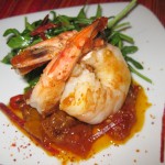 Sautéed shrimp and chorizo with citrus piperade mesclun salad