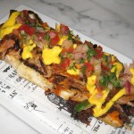 Chicharron de costillas: crispy pork ribs crostini, sweet potato puree, feta cheese sauce and salsa criolla