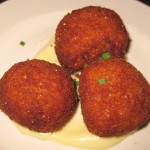 Croquetas de pollo y jamón: fried bechamel, caramelized onions, chicken, jamón serrano