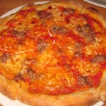 Housemade organic Italian sausage pizza: tomato, fresh mozzarella, hand-picked oregano and fennel pollen