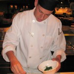 Cook Luis Arias Ruiz preparing pan con tomate
