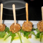 Manchego y membrillo con almendras marconas: manchego cheese, quince rolled in marcona almonds with arugula