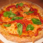 Margherita: tomato, fresh mozzarella, sweet basil and organic extra virgin olive oil