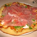 White pizza: prosciutto, burrata, arugula and truffle oil