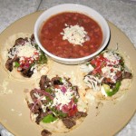 All natural steak tacos, avocado, Cotija cheese, tomatillo salsa, sour cream and Anasazi beans