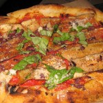Eggplant pizza with tomato, parmesan and oregano