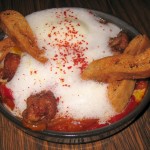 Farm egg shakshouka, yogurt, sweetbread and pita