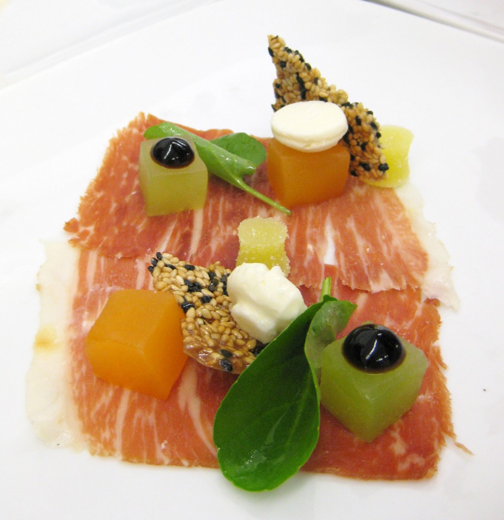Iberico ham: Tuscan melons, manchego, soy-balsamic gel, sour olive oil, black sesame