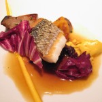 Wild Loup de Mer "En Ecailles" with salsify, matsutake mushrooms, roasted onion and matsutake brown butter broth