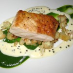 Pan-seared sturgeon with broccoli puree, cauliflower florets and caviar cream