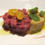 Tuna tartar with a blood orange vinaigrette, artichoke purée, haricots verts and celery