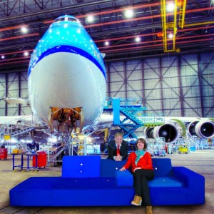 Hella Jongerius, Dutch top designer and Erik Varwijk, Managing Director KLM on the famous ‘polder sofa’ in the KLM-hangar, in front of a Boeing 747-400.