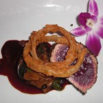 Bigeye tuna “au poivre” with wild mushrooms and shishito peppers from Wolfgang Puck's American Grille