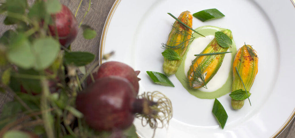 Lobster stuffed squash blossoms by chef Daniel Rose at Le Coucou, NYC (Photo by Corry Arnold)