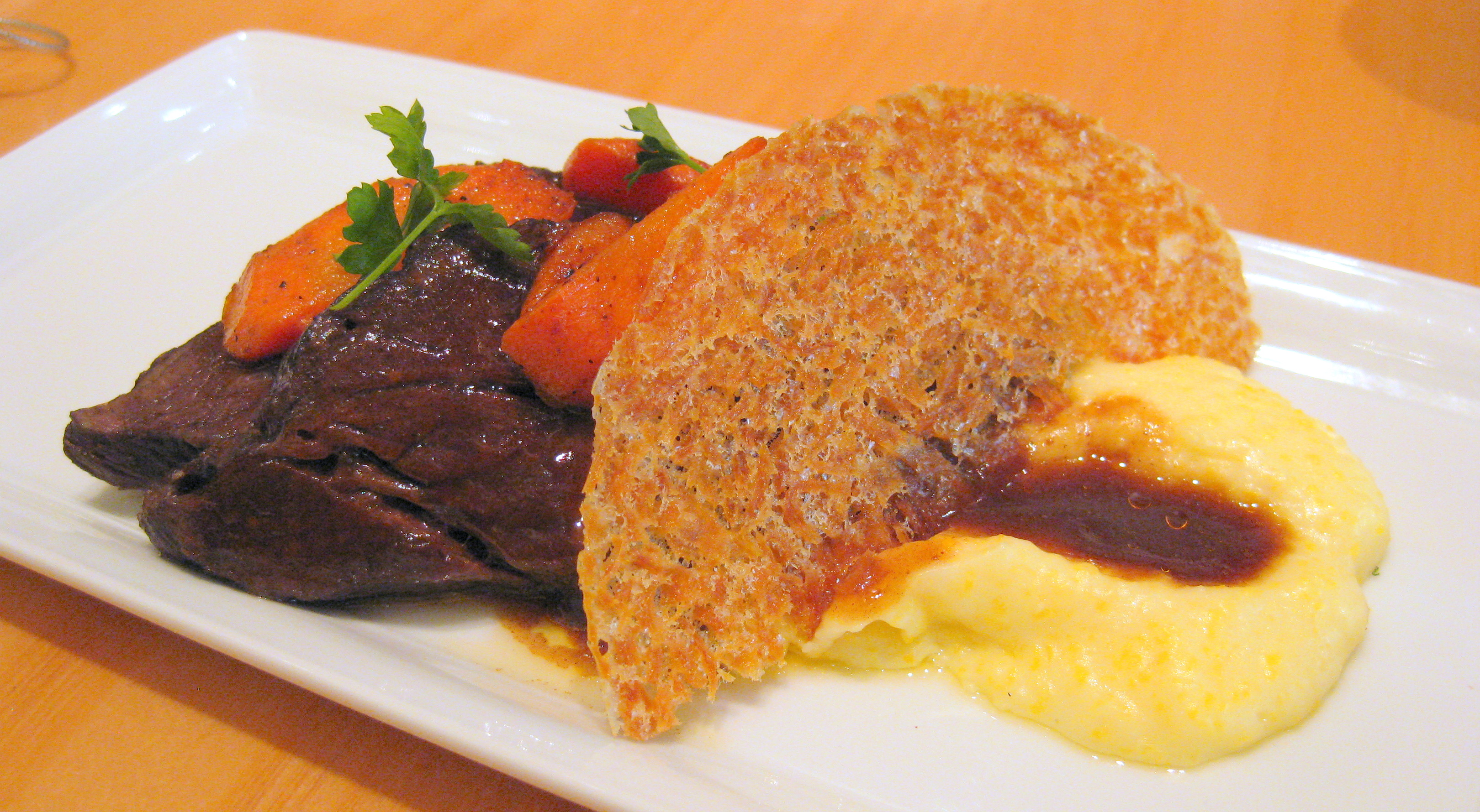 72-hour braised short rib with polenta and Syrah sauce