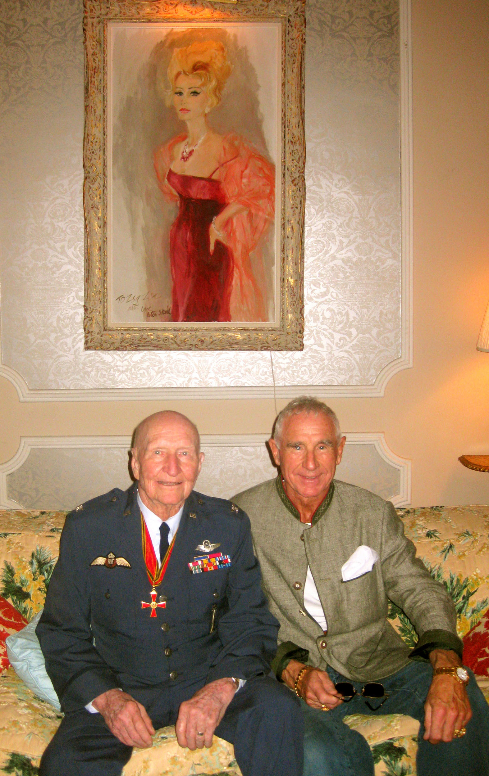 Colonel Gail Halvorsen with Prince Frederic von Anhalt under a portrait of Zsa Zsa Gabor